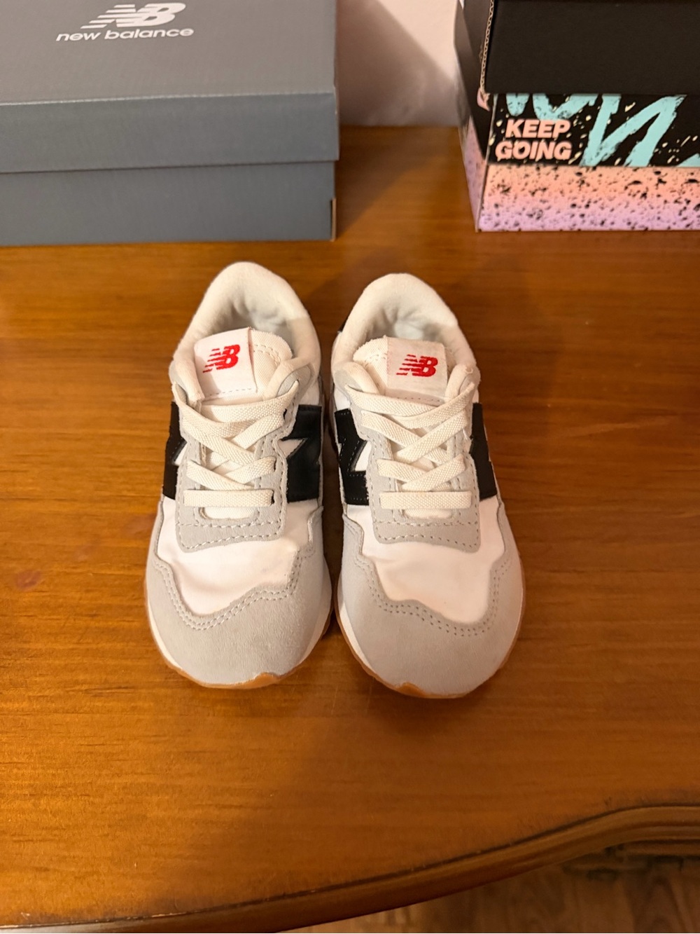 New Balance Kids White, Gray & Black Sneakers with Red Logo